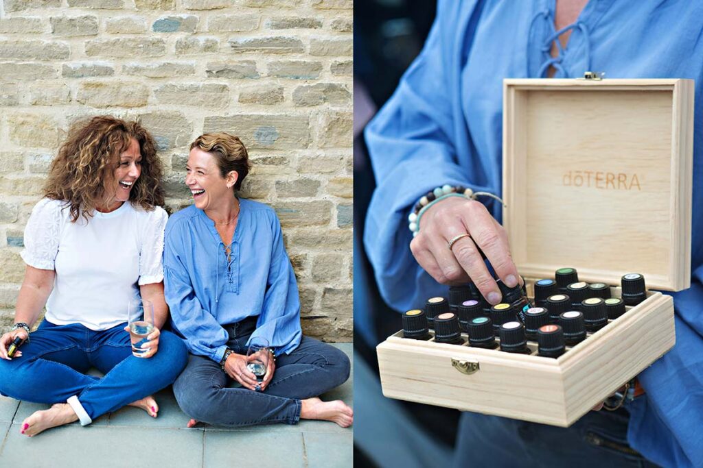 Brand photos of two women casually sitting against a wall with a glass of water for their brand doTerra an essential oil brand