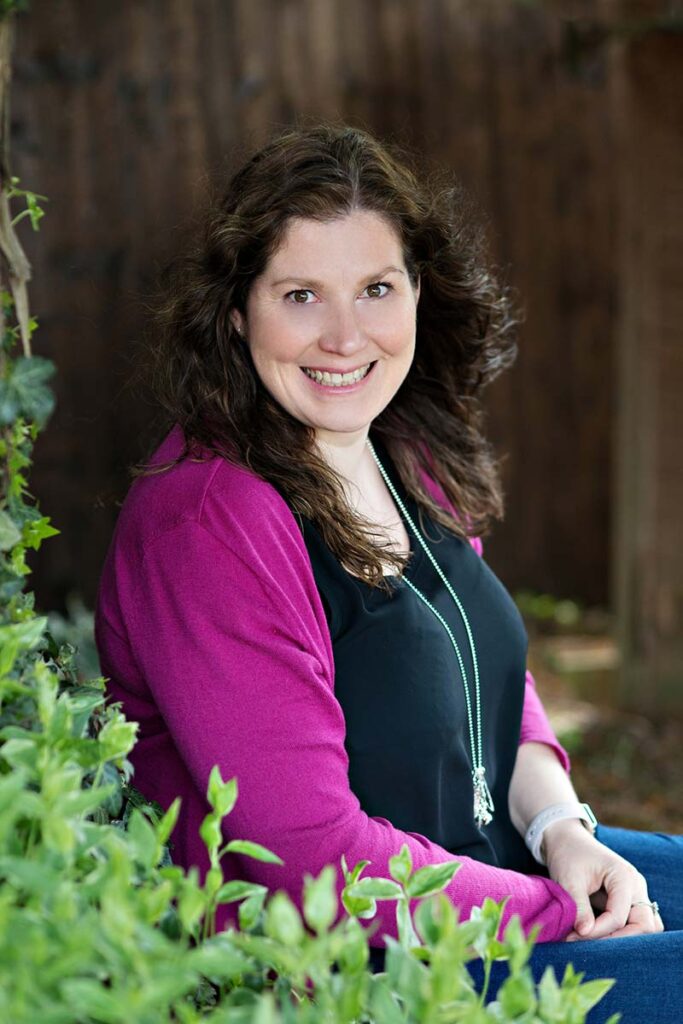 A photo of a lady smiling to camera 