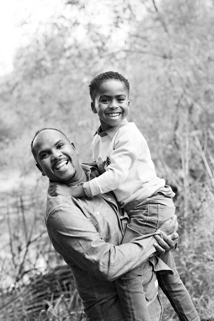 A brown father, lifting his son, photo by family photographer Siobhan Murphy